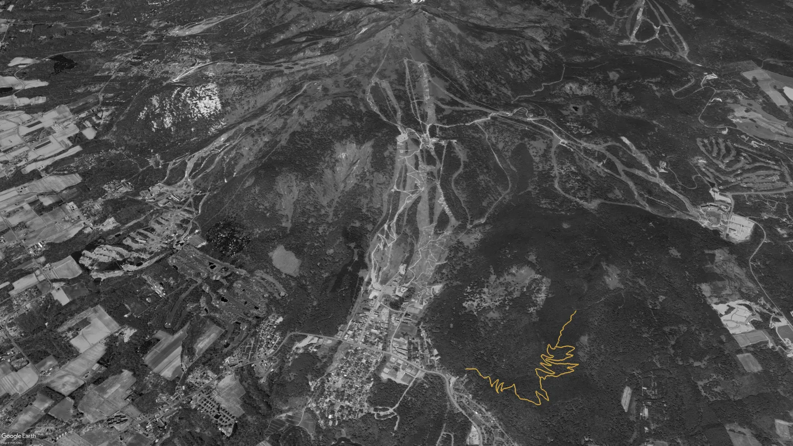 Satellite view of the Niseko mountain bike network in 2022 with the first NAMBA trails traced in gold above Kutchan