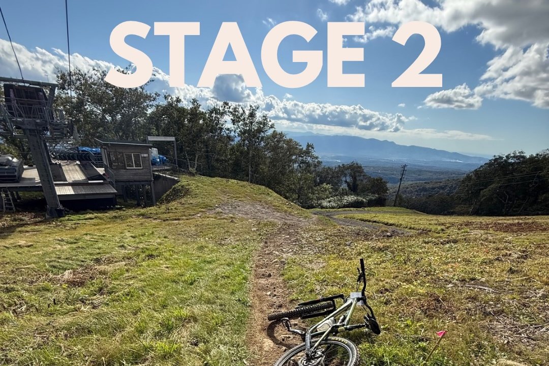 The stage two start by the lift off-ramp, with singletrack dropping away through open grass