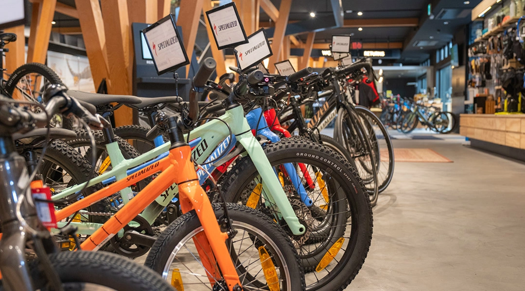 Mountain bikes lined up at a Niseko rental shop