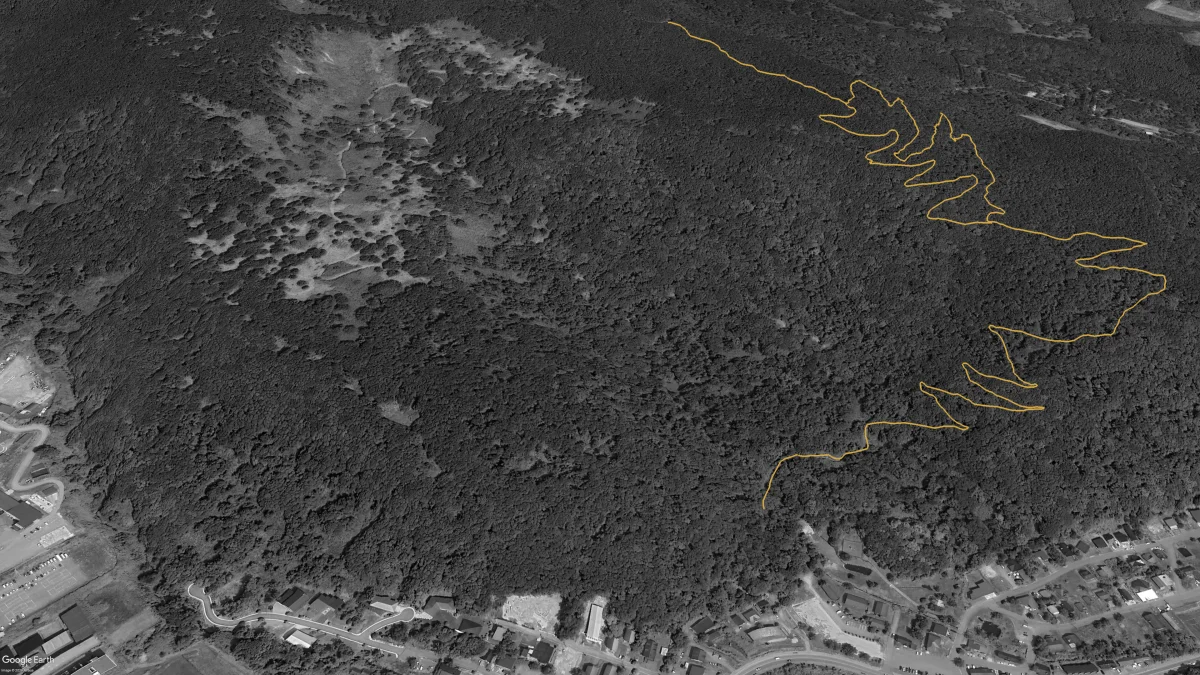 Aerial view of Twin Peaks in 2022 showing the first 4.4km of trail traced in gold on the ridge above Kutchan