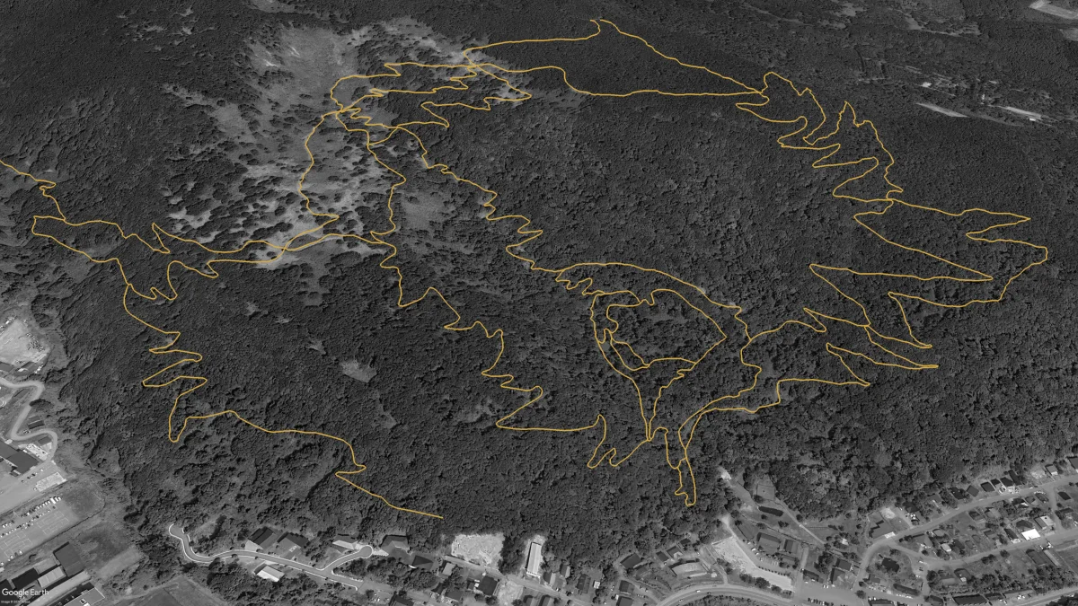 Aerial view of Twin Peaks in 2024 showing the network grown to 13.8km with the first double-black trails Taki Trail and Taki Tech