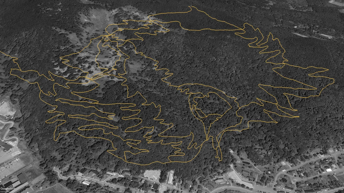 Aerial view of the planned future Twin Peaks network with the lower west climb completed and the region's first green downhill trail added